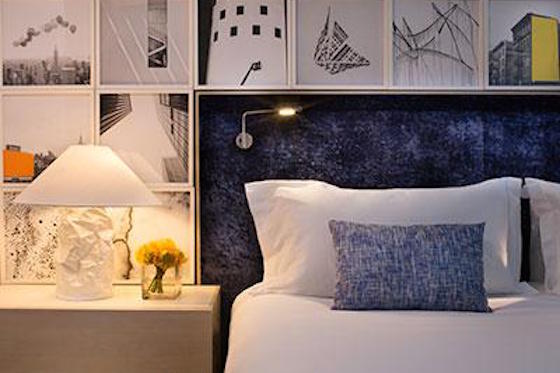 Guestrooms feature a neutral color palette with pops of color