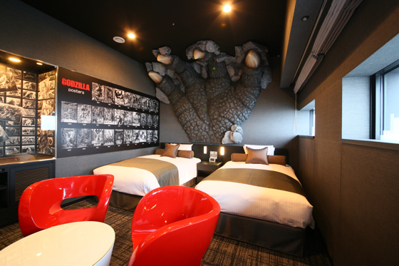 The Godzilla Room features a life-size replica of Godzilla’s claw looming over the beds. (photo by TM & (C)TOHO CO. LTD.)