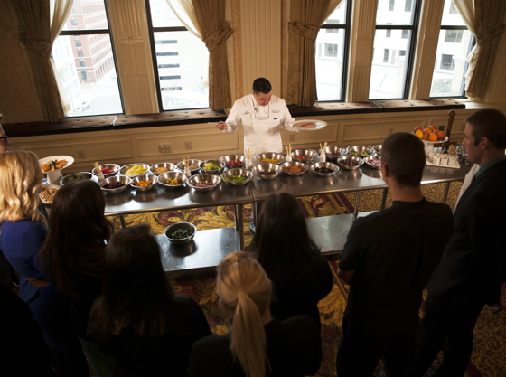 Pfister Executive Chef Brian Frakes shows guests ingredients for their own salad works of art during the #foodart Experience.