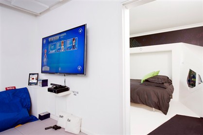 The guestroom features a large, flatscreen HDTV and Xbox 360 game console and Kinect sensor.