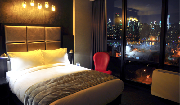 Nighttime view of Manhattan from a guest room.