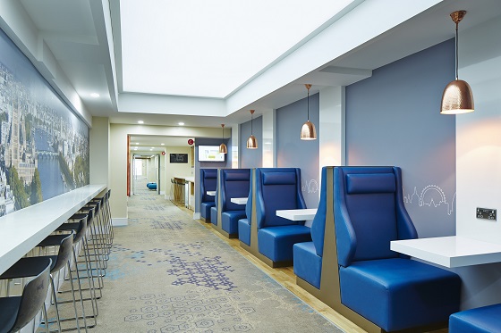 Blue seating has a contemporary feel.