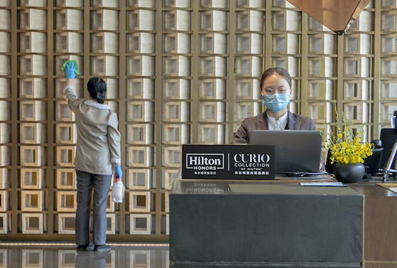 Cleaning the lobby of Hilton's Curio Xiamen, China