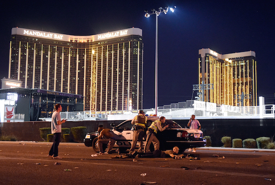 Las Vegas police stand guard along the streets outside the Route 91 Harvest Country music festival grounds of the Route 91 Harvest on October 1 in Las Vegas (Getty Images)