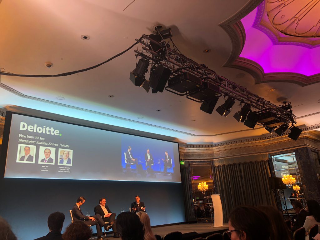 IHG CEO Keith Barr and Federico Gonzalez, president and CEO of Radisson Hotel Group, talk to Andreas Scriven, head of hospitality and leisure at Deloitte. 