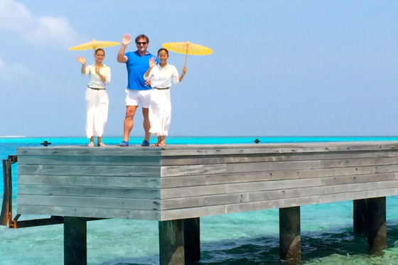 GM Renato Chizzola and staff wave to guests departing from the resort's jetty.