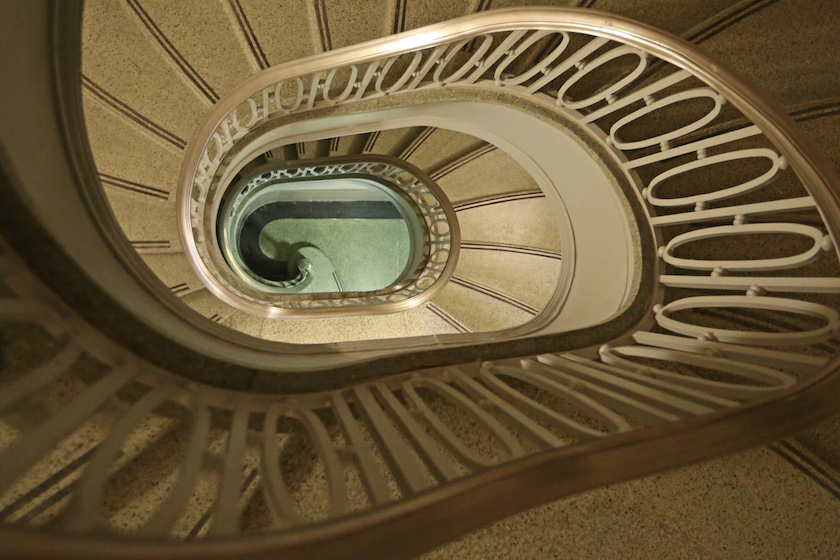 Elements such as this staircase highlight the historic significance of the building.