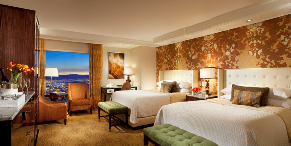 A Resort Queen Room with the amber-and-butterscotch motif.