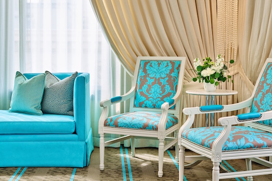 Guestroom details include Tiffany blue hue Chesterfield sofas and chairs