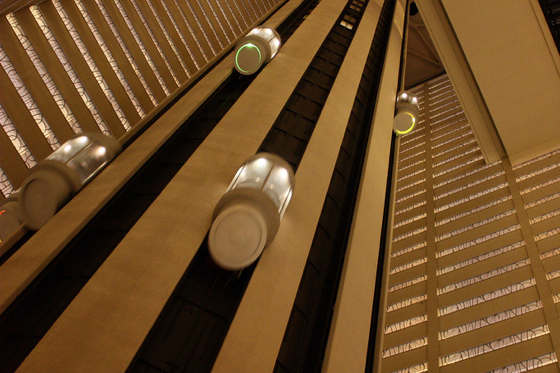The famous elevators of the New York Marriott Marquis rising and descending. Photo by Yoshizumi Endo/CC