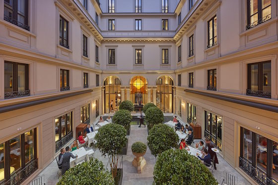 The courtyard is used for additional seating for the hotel's restaurant, Seta.