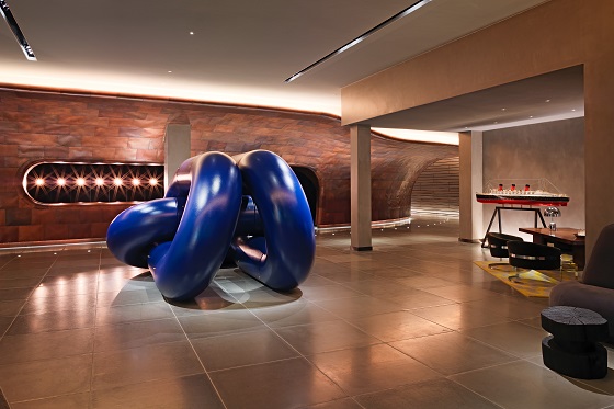 A blue sculpture anchors the lobby.