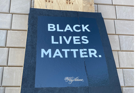 Newly fixed signs on the boarded-up facade of the Hay-Adams