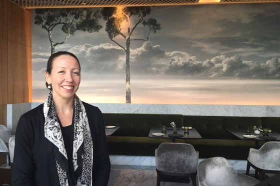      (cAnneke Brown in front of one of Wildflower restaurant's non-PVC wallpaper images by Valerie Sparks