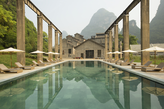 Pool with karst mountains in the background at Alila Yangshuo