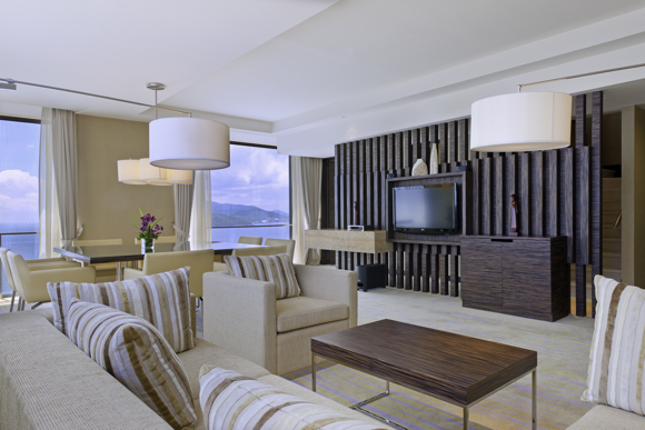 In addition to floor-to-ceiling windows, the living room in the two-bedroom apartments includes a 42-inch (107-cm) flat screen LCD television. Photos used courtesy of Sheraton Nha Trang Hotel & Spa