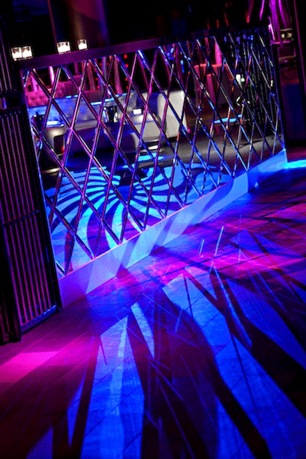 Diamond-shaped mirrors adorn the bar and DJ booth.