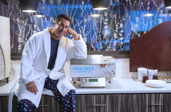Comedian Rob Riggle is spearheading Holiday Inn Express’ new “Pancakes at Night” promotion.