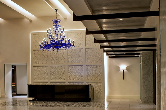 A blue chandelier accents the lobby.