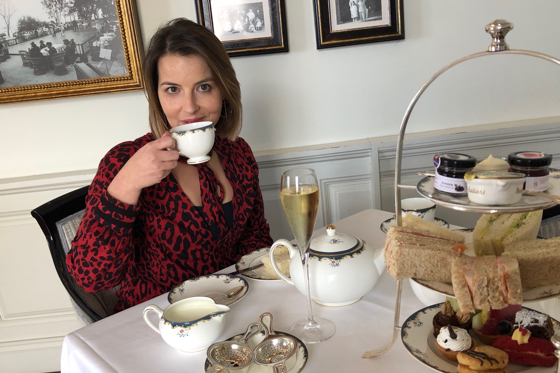 Patricia Duarte takes tea in front of historic photographs at Belmond Reid's Palace     