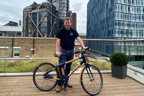 James Clarke with a bamboo bike at the Hilton London Bankside