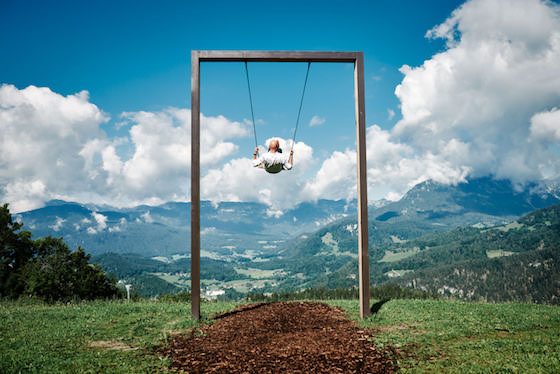 Werner Müller swings high outside Kempinski Berchtesgaden Resort.