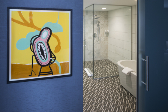 Each guestroom features local art.