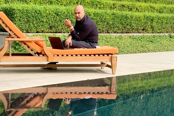 Jay Rathore working, last week, at an unusually empty poolside at The Oberoi, New Delhi