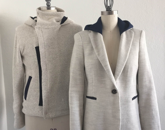 Front-desk uniforms feature gray blazers with removable hoodies.