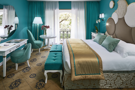 Teal and golden yellow guestroom
