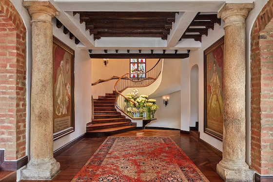 Four Seasons Hotel Casa Medina Bogotá's design incorporates stone columns and wood flooring. 