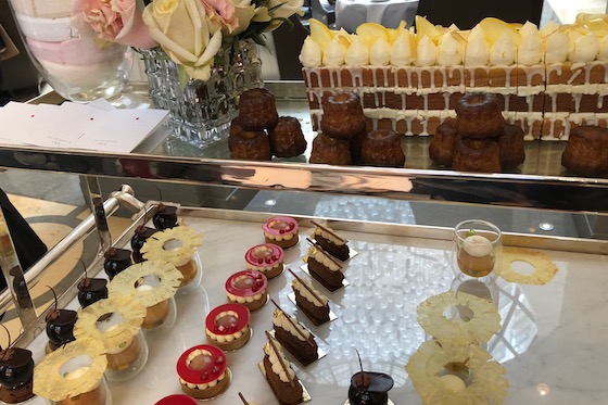 An antique trolley serves up bite-sized cakes. 