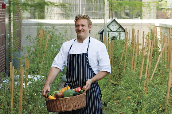 Anthony Paris, head chef at Firmdale's Crosby Street Hotel in New York City, tends to the rooftop garden.