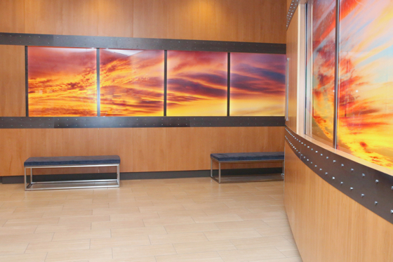 Back lit images of clouds and nebulas adorn the corridors leading to meeting rooms.