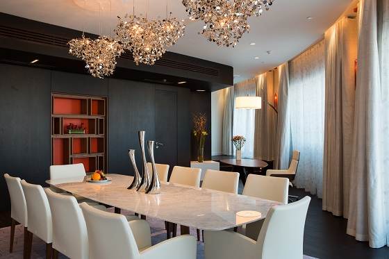 Silver chandeliers sparkle in the dining area.