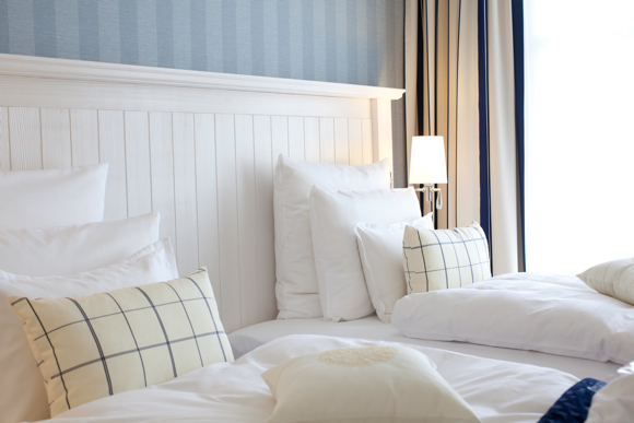 Guestrooms follow a “Baltic chic” concept with fresh whites, sandy tans and varying shades of blue.