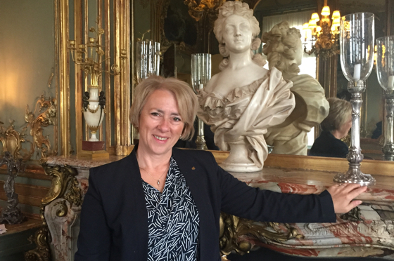 GM Sue Williams stands in front of a bust of Marie Antoinette in Cliveden's formal dining room.